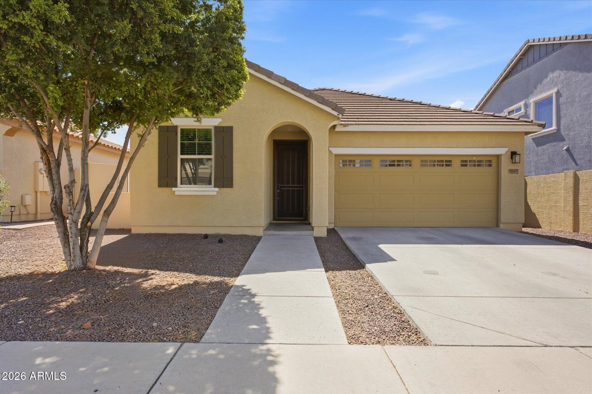3347 East Roland Street Mesa, AZ 85213 - Photo 1 of 25 a front view of a house