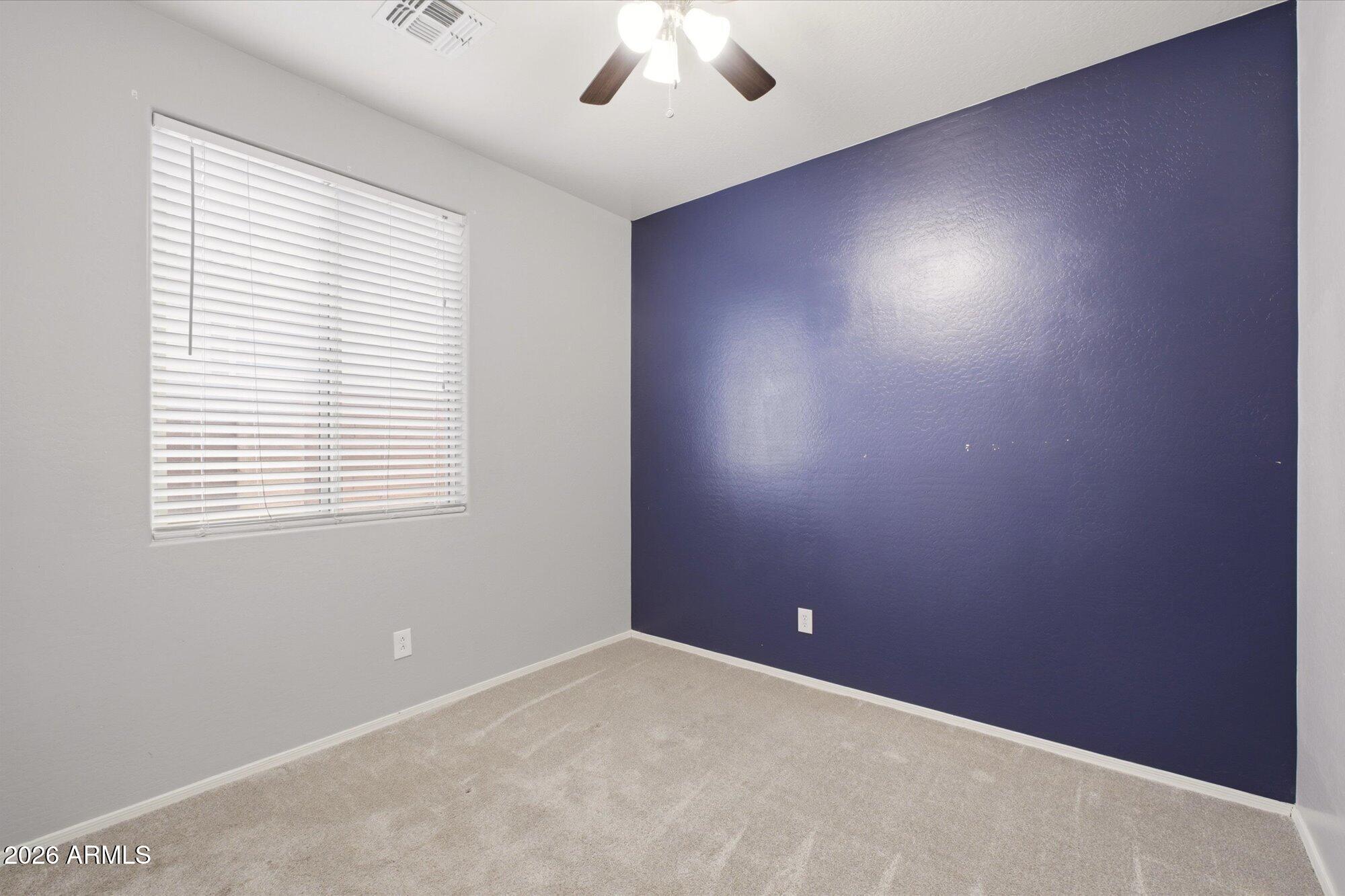 3347 East Roland Street Mesa, AZ 85213 - Photo 15 of 25 an empty room with a window