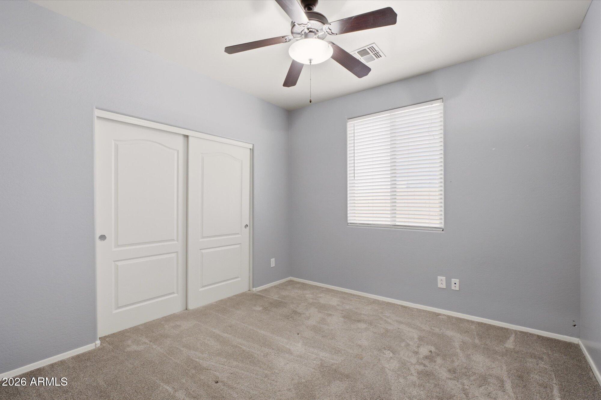 3347 East Roland Street Mesa, AZ 85213 - Photo 17 of 25 a view of an empty room with a window