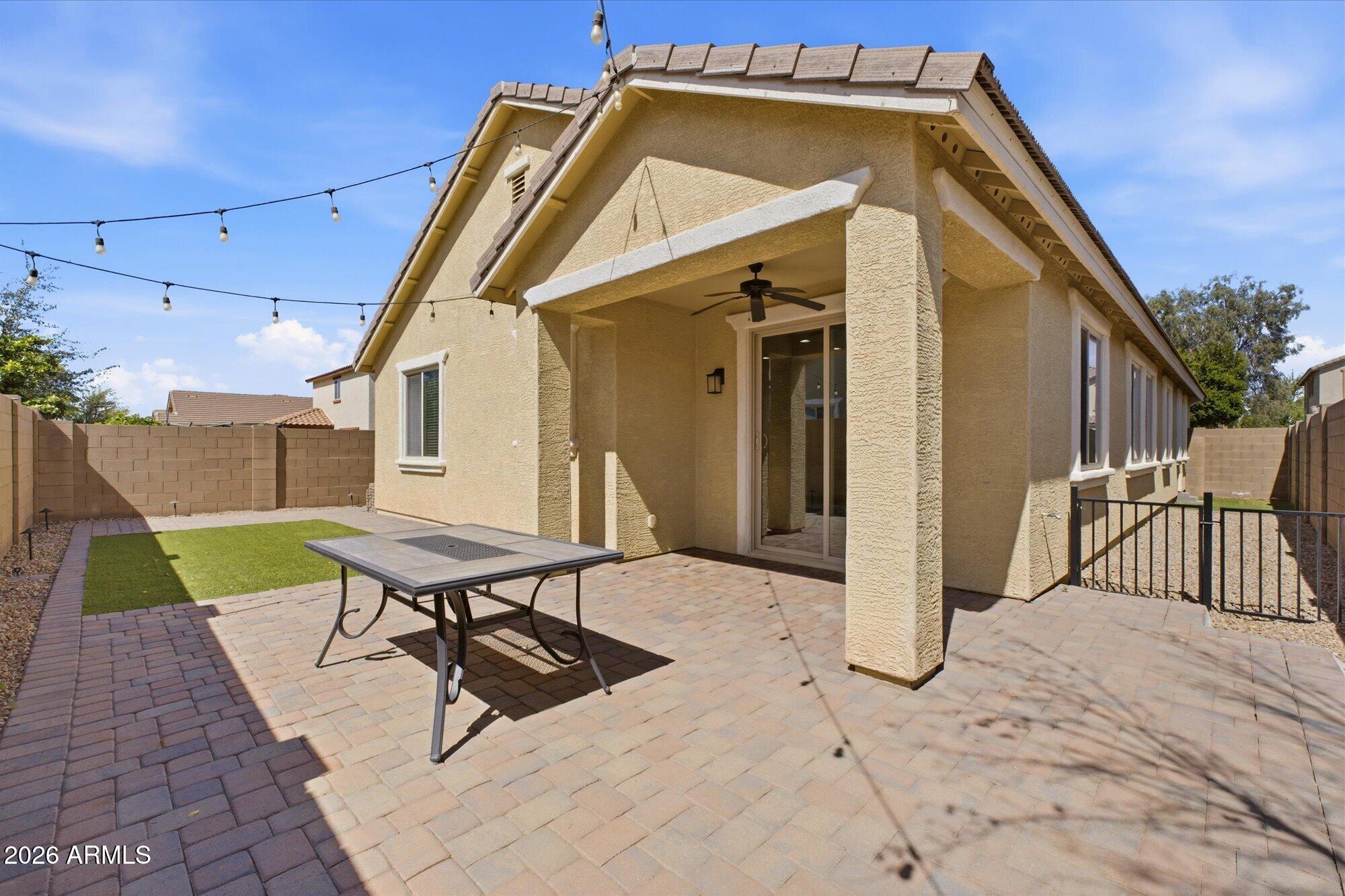 3347 East Roland Street Mesa, AZ 85213 - Photo 23 of 25 a backyard of a house with table and chairs