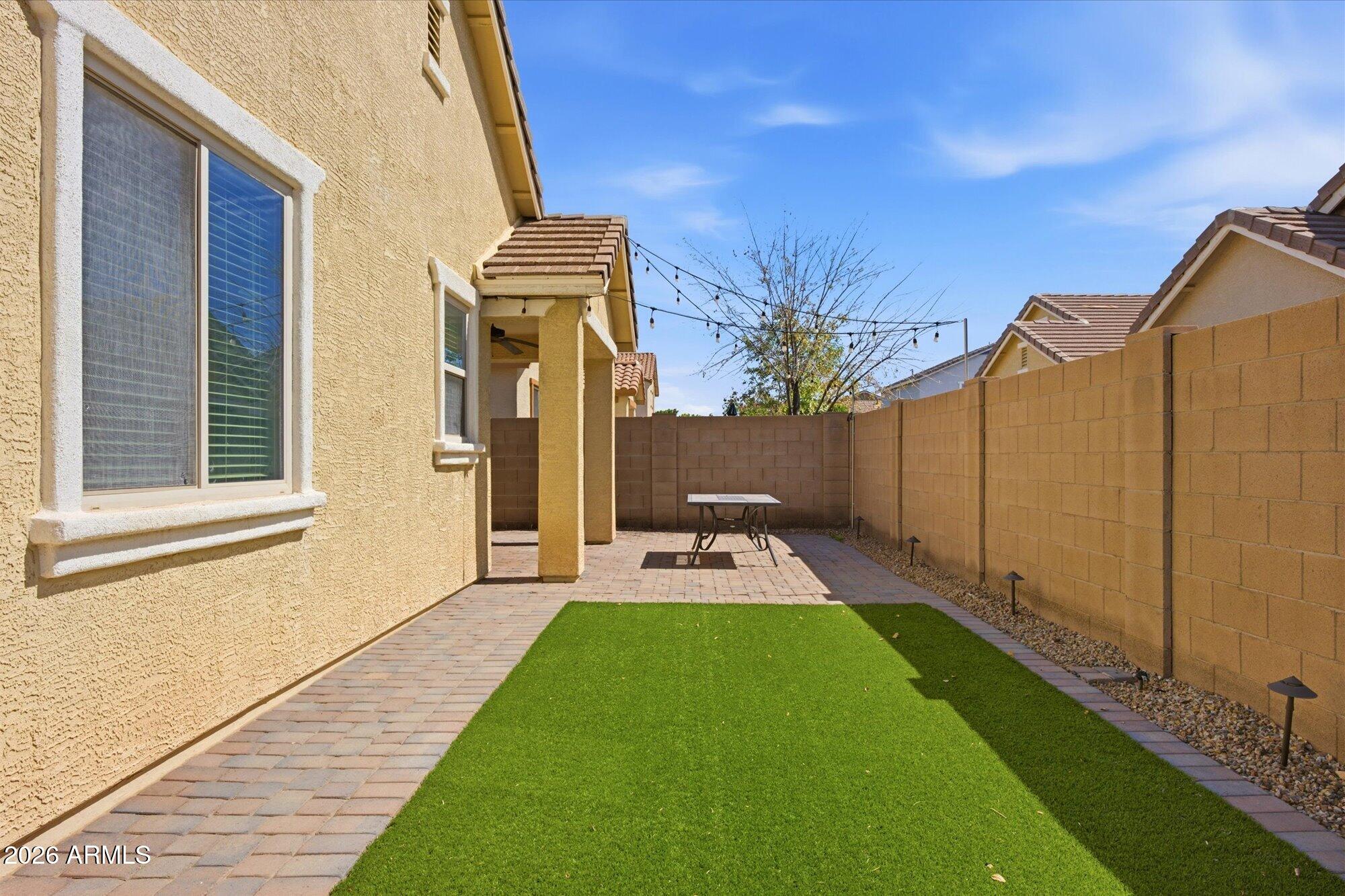 3347 East Roland Street Mesa, AZ 85213 - Photo 24 of 25 a front view of a house with garden