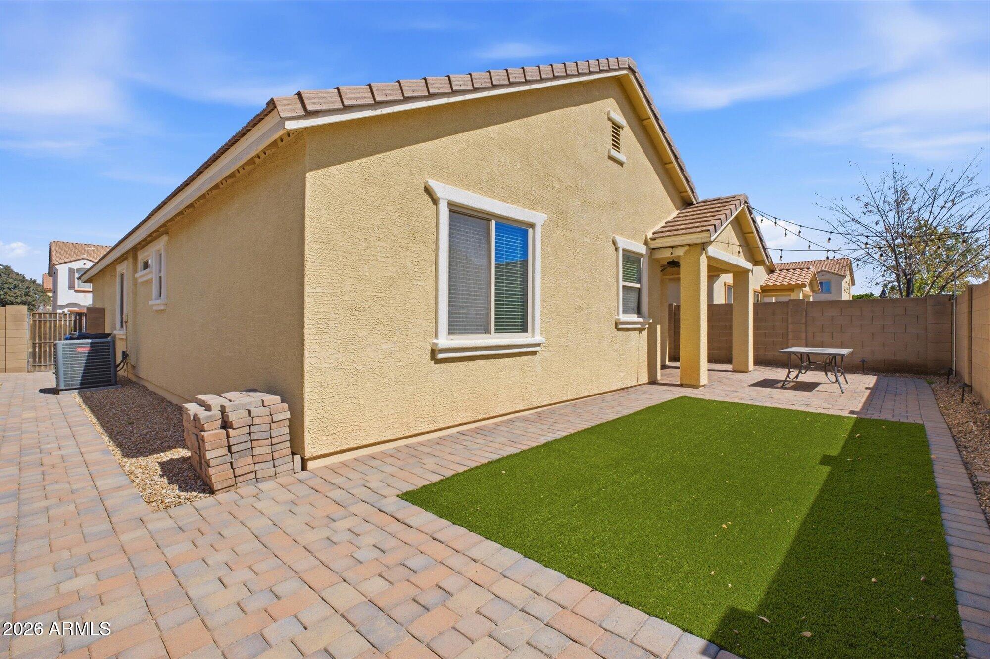 3347 East Roland Street Mesa, AZ 85213 - Photo 25 of 25 a view of backyard with a patio