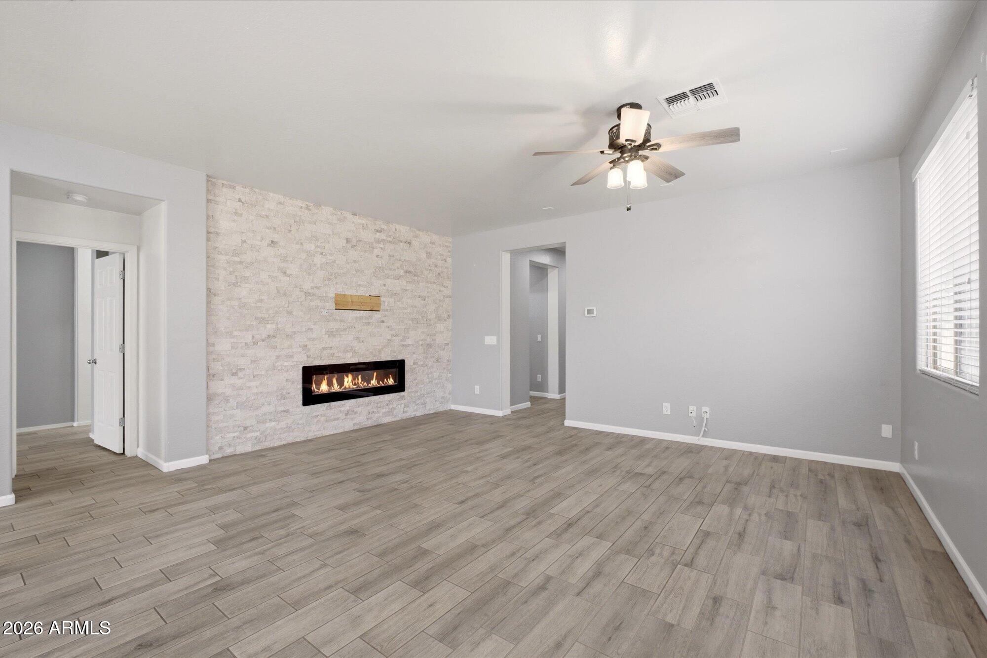3347 East Roland Street Mesa, AZ 85213 - Photo 4 of 25 wooden floor in an empty room