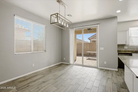 a view of a kitchen with a sink and dishwasher wooden floor