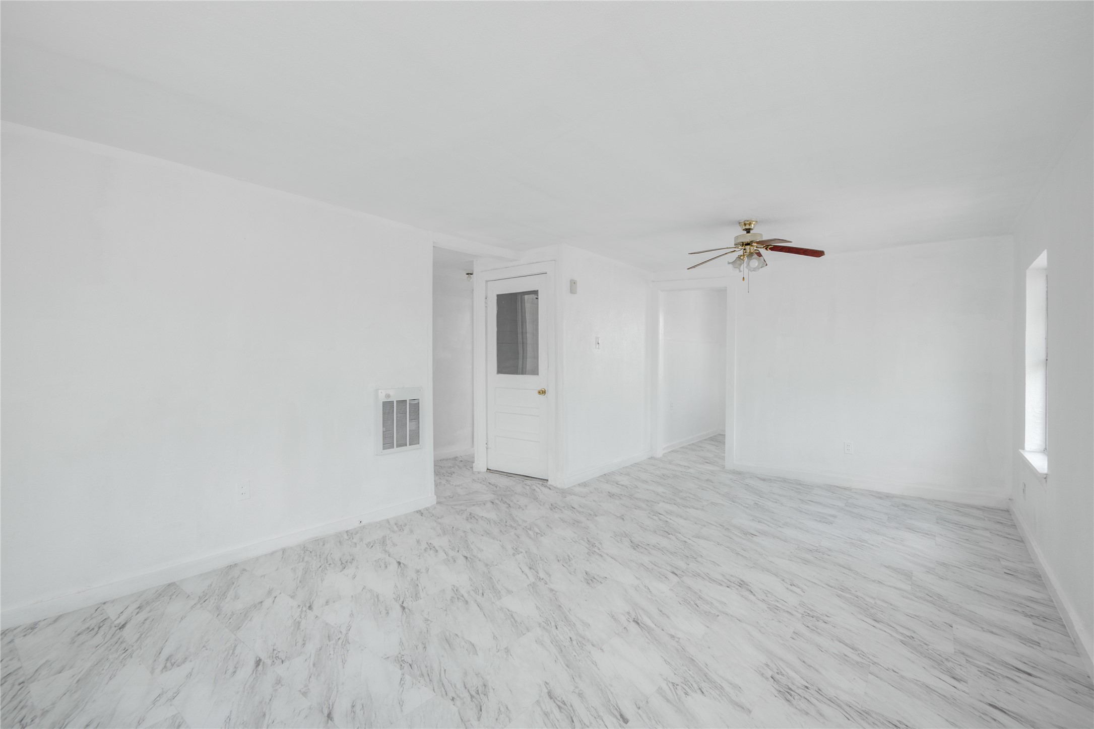 1131 West 2nd Street Freeport, TX 77541 - Photo 13 of 30 a view of an empty room with a window