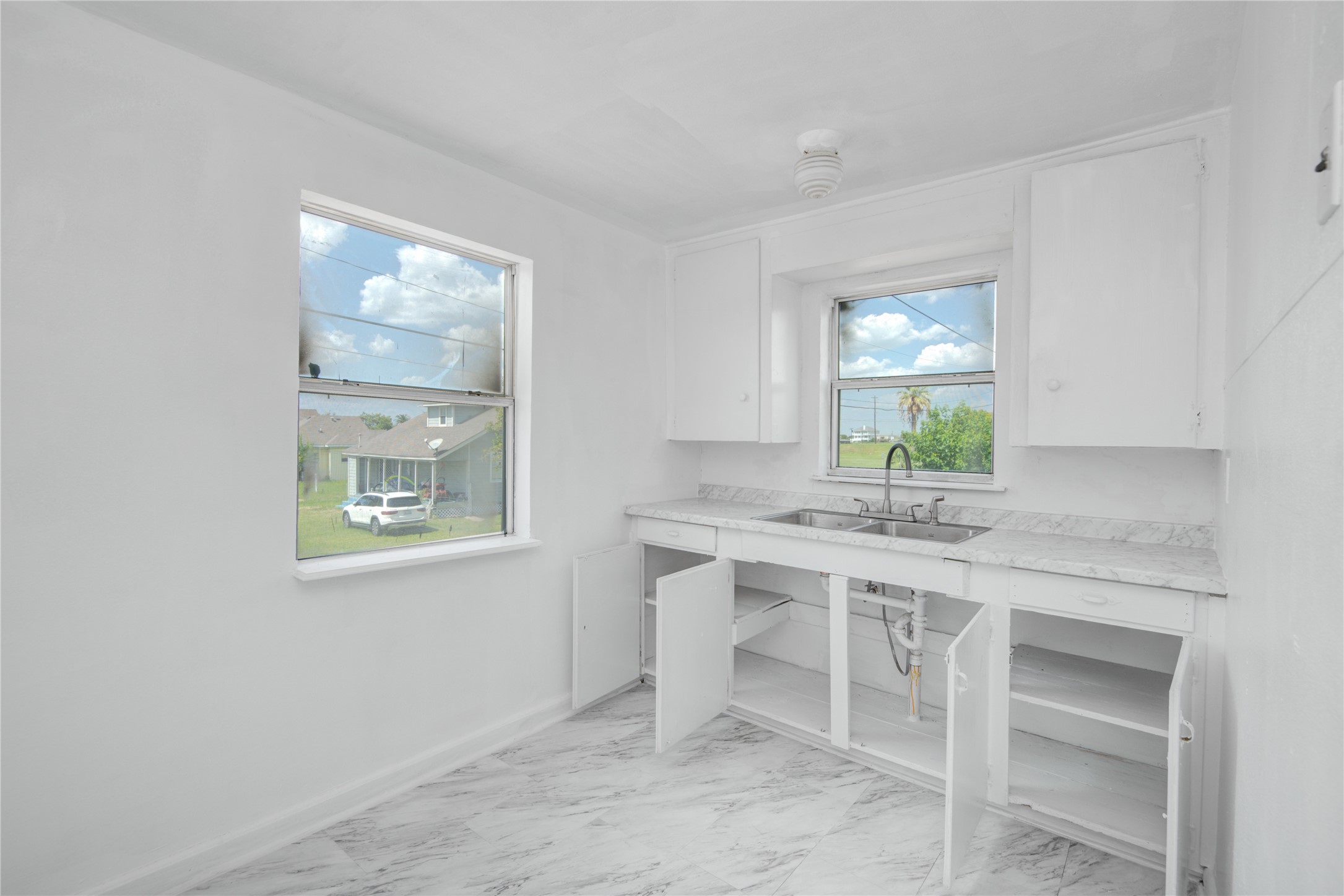 1131 West 2nd Street Freeport, TX 77541 - Photo 14 of 30 a kitchen with a table and chairs in it