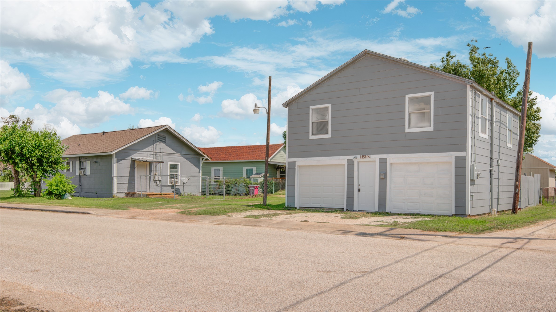 1131 West 2nd Street Freeport, TX 77541 - Photo 30 of 30 a front view of a house with a yard