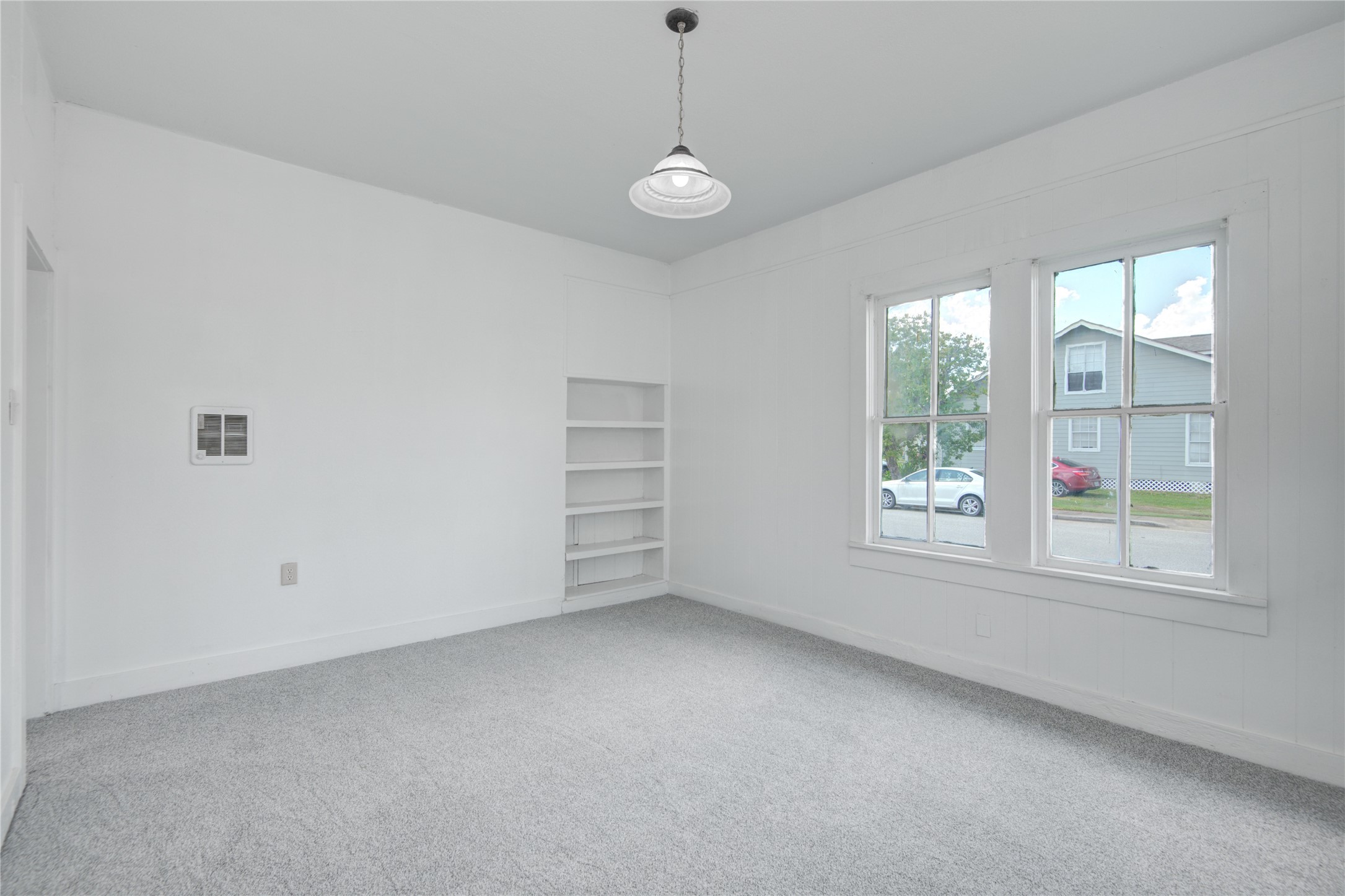 1131 West 2nd Street Freeport, TX 77541 - Photo 5 of 30 a view of a room with windows and chandelier