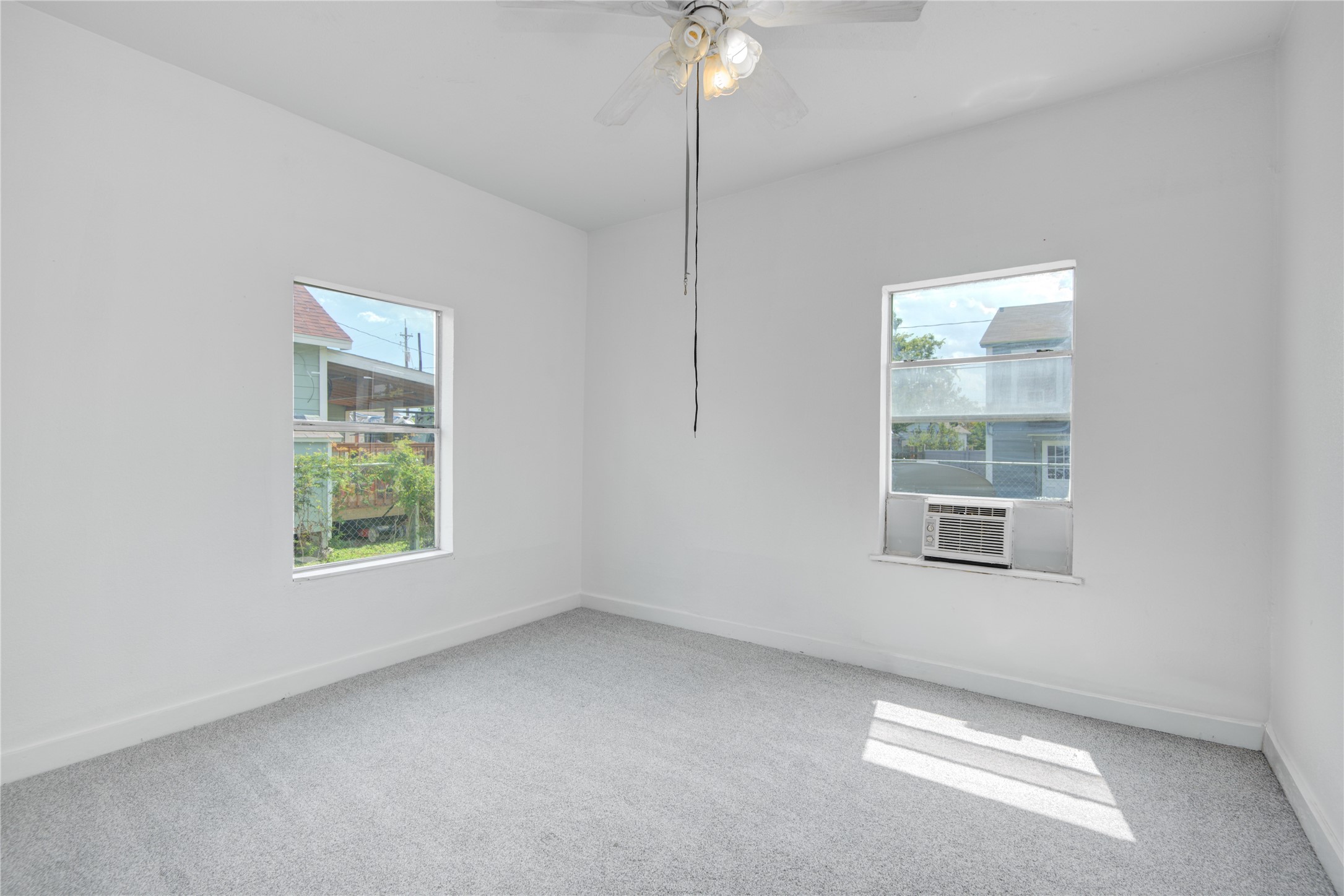 1131 West 2nd Street Freeport, TX 77541 - Photo 10 of 30 an empty room with a window