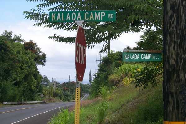 Kalaoa Camp Road Papaikou, HI 96781 - Photo 3 of 11 a sign that is sitting on a side of a road