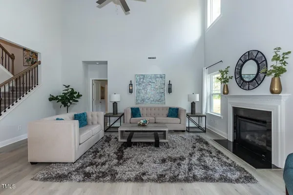 a living room with furniture and a fireplace