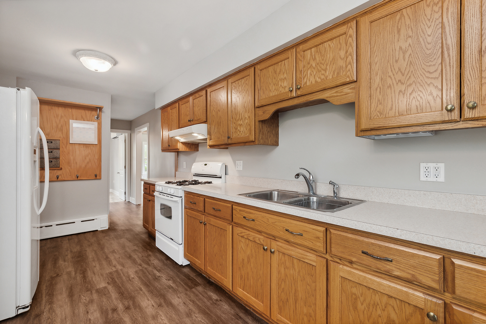 829 South Cedar Road New Lenox, IL 60451 - Photo 11 of 23 a kitchen with stainless steel appliances granite countertop a sink a stove and cabinets