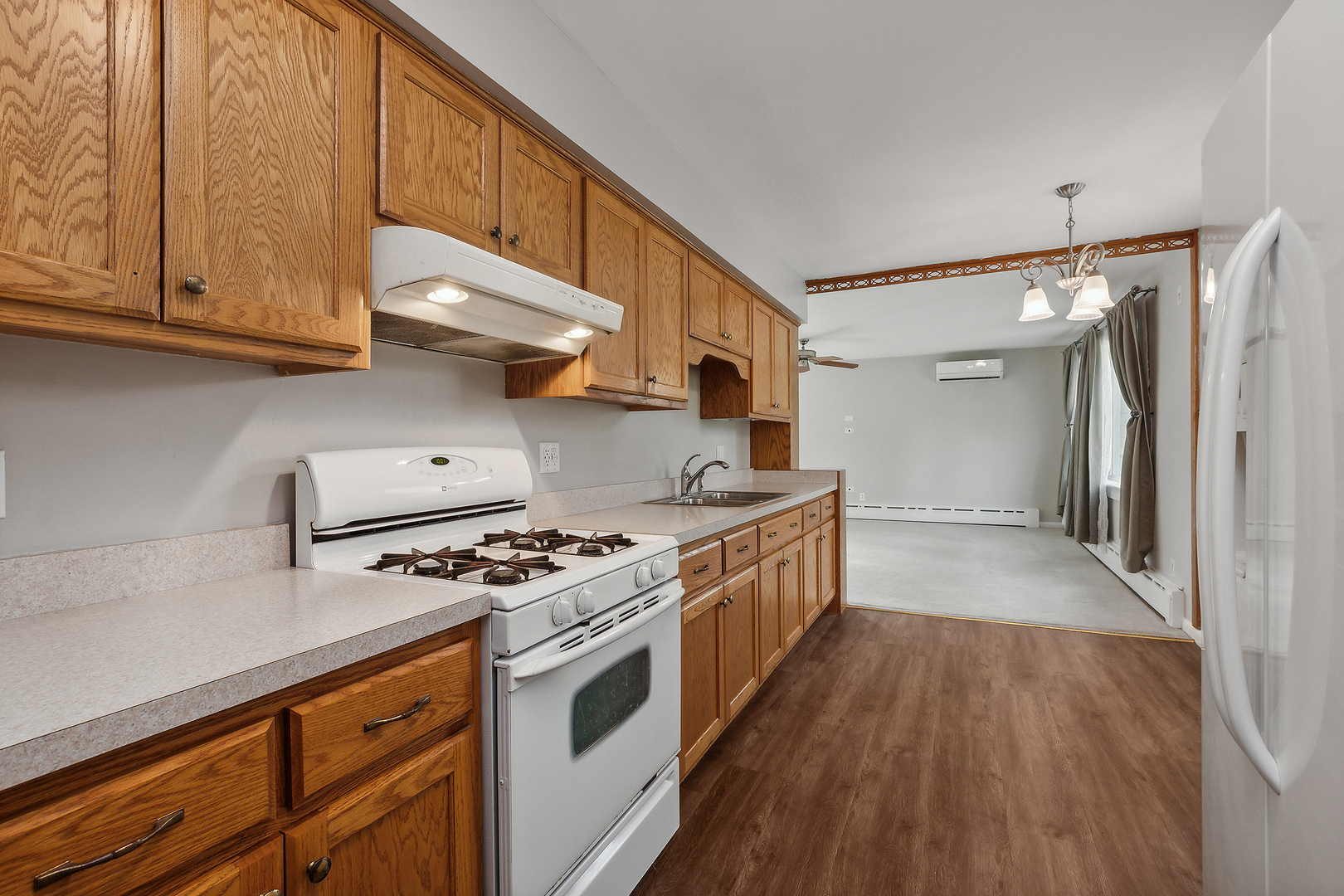 829 South Cedar Road New Lenox, IL 60451 - Photo 12 of 23 a kitchen with stainless steel appliances granite countertop a stove and a refrigerator