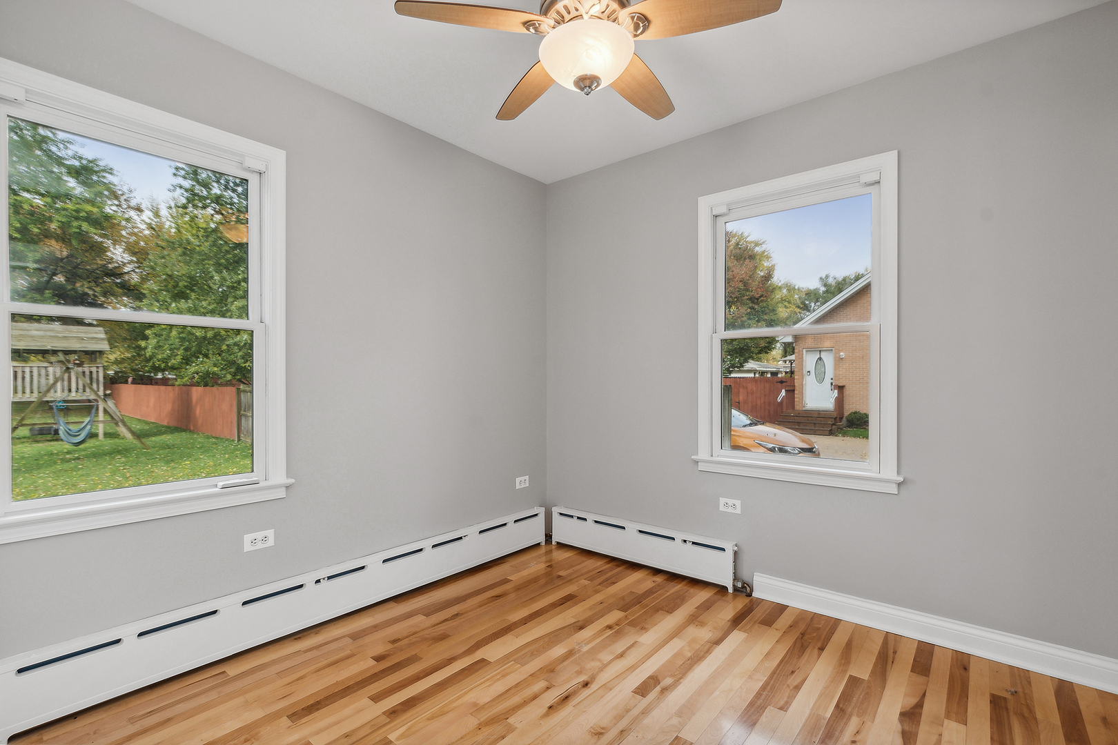 829 South Cedar Road New Lenox, IL 60451 - Photo 14 of 23 a view of an empty room with wooden floor and a window