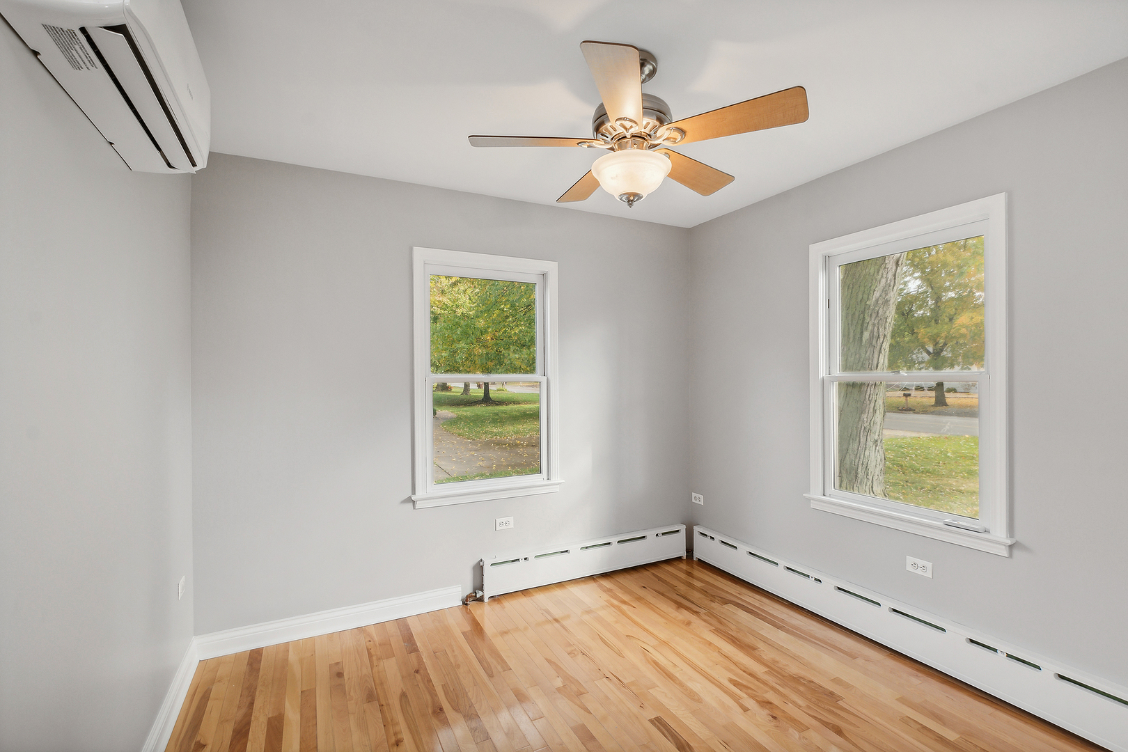 829 South Cedar Road New Lenox, IL 60451 - Photo 15 of 23 wooden floor in an empty room with a window