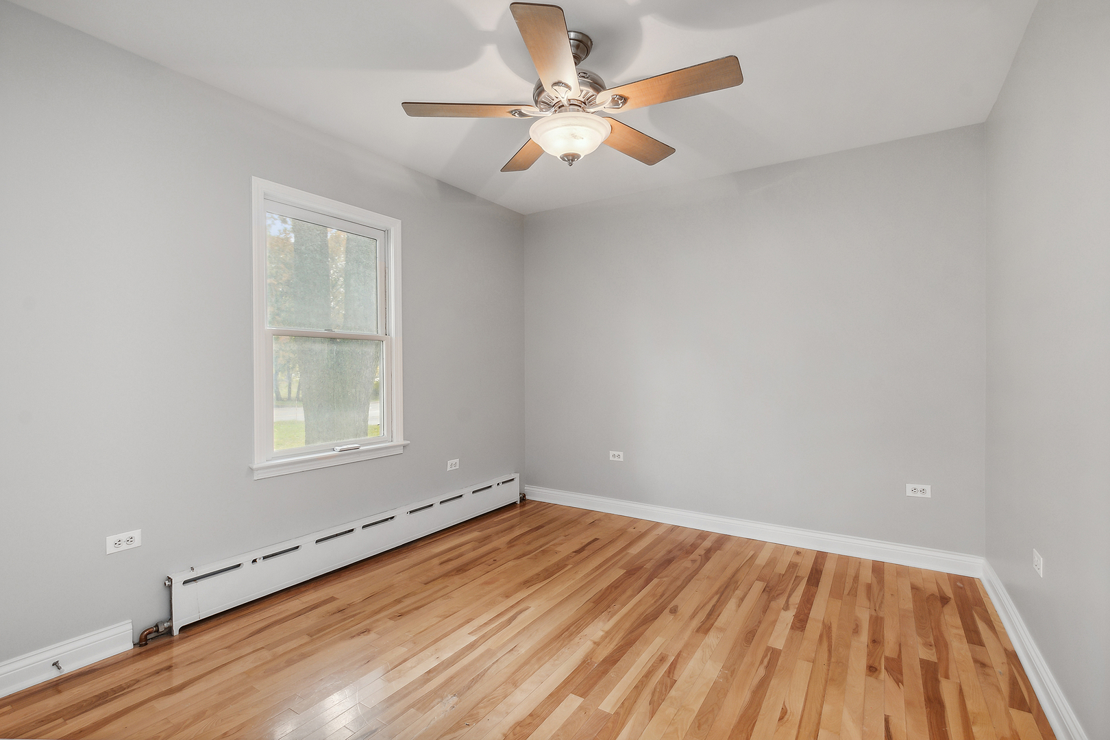829 South Cedar Road New Lenox, IL 60451 - Photo 16 of 23 wooden floor in an empty room with a window