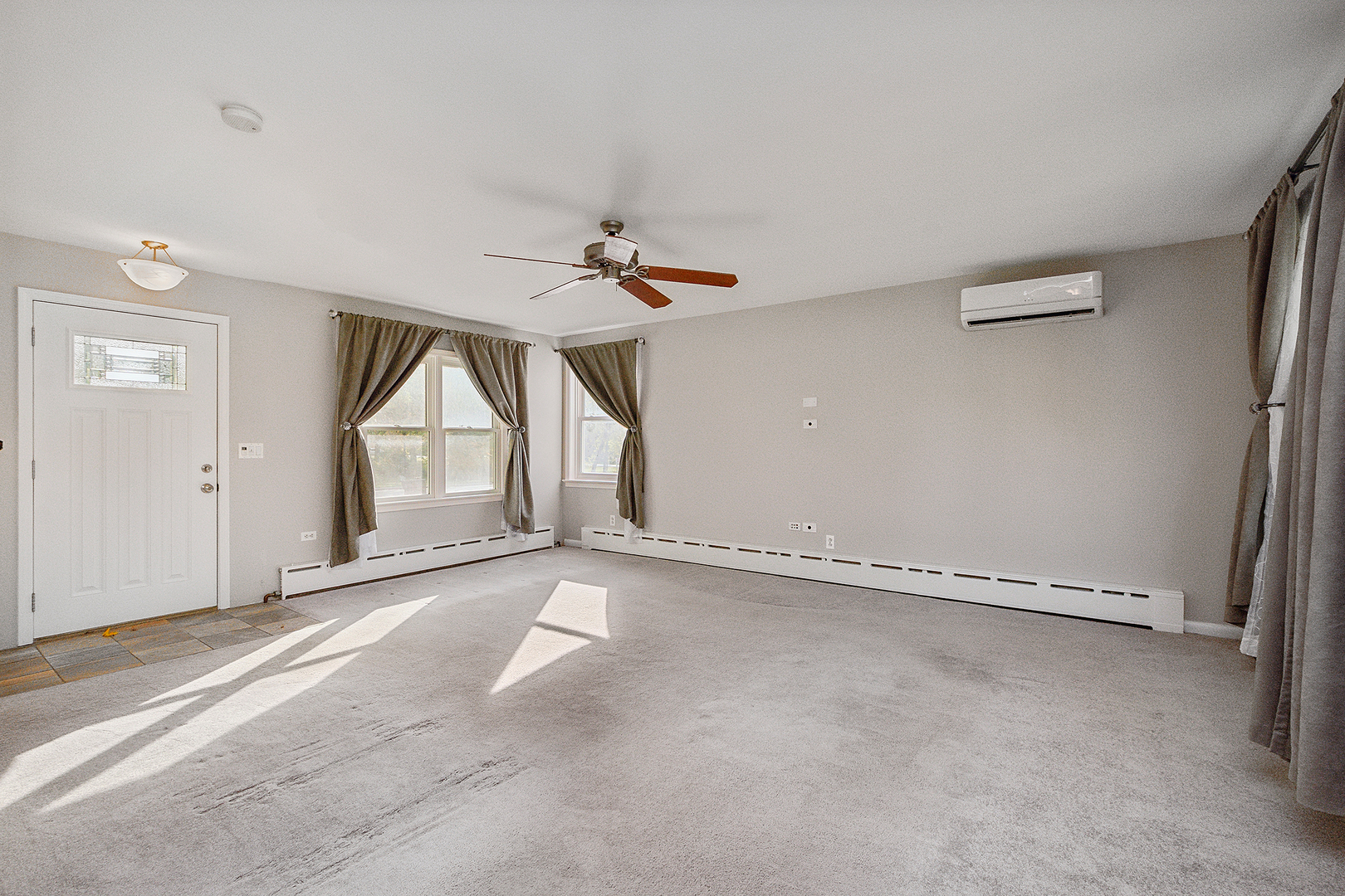829 South Cedar Road New Lenox, IL 60451 - Photo 8 of 23 an empty room with a empty space and windows