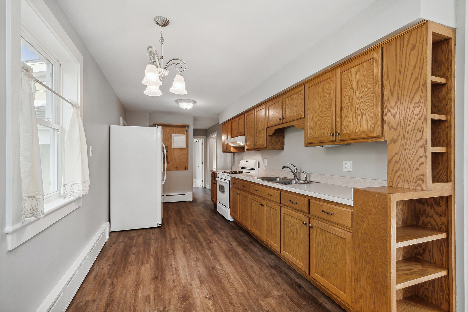 829 South Cedar Road New Lenox, IL 60451 - Photo 10 of 23 a kitchen with stainless steel appliances granite countertop a refrigerator a sink dishwasher a stove and white cabinets with wooden floor