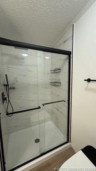 16537 Southwest Two Wood Way Indiantown, FL 34956 - Photo 12 of 14 a bathroom with a shower