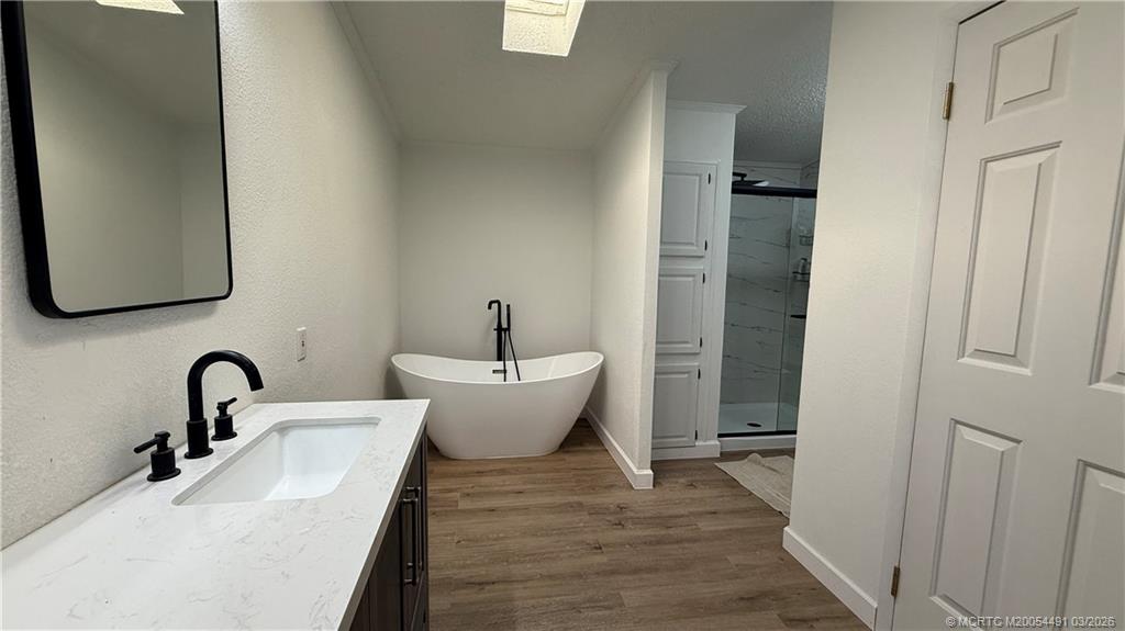 16537 Southwest Two Wood Way Indiantown, FL 34956 - Photo 13 of 14 a bathroom with a sink and mirror