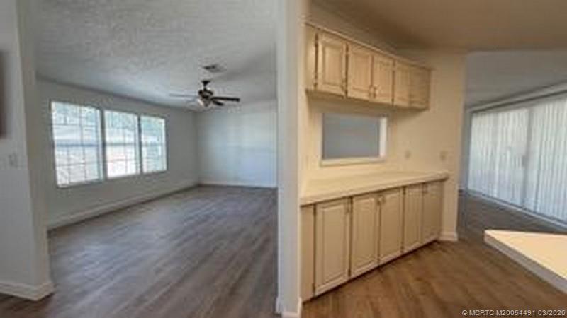 16537 Southwest Two Wood Way Indiantown, FL 34956 - Photo 7 of 14 wooden floor in an empty room with a window