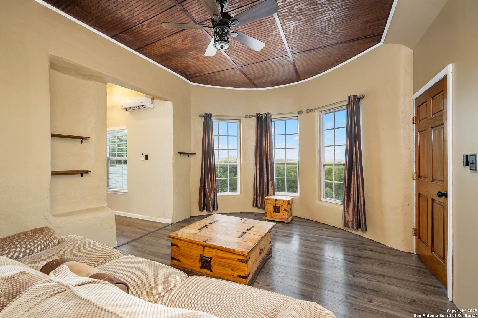 10655 Rebecca Creek Road Spring Branch, TX 78070 - Photo 20 of 34 a living room with furniture and a large window