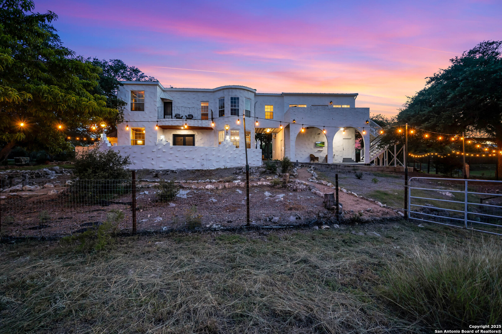 10655 Rebecca Creek Road Spring Branch, TX 78070 - Photo 30 of 34 a view of a house with a yard