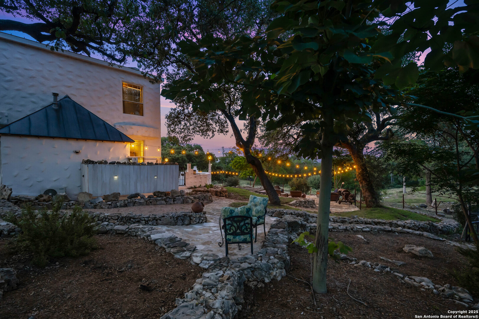 10655 Rebecca Creek Road Spring Branch, TX 78070 - Photo 33 of 34 a view of a house with a yard