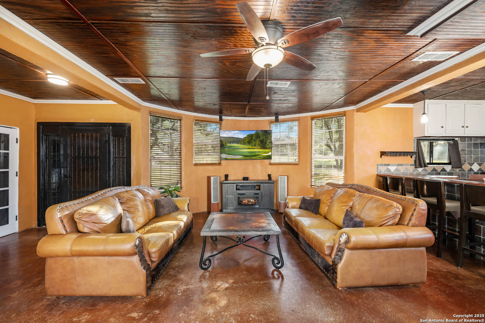 10655 Rebecca Creek Road Spring Branch, TX 78070 - Photo 8 of 34 a living room with furniture and a large window