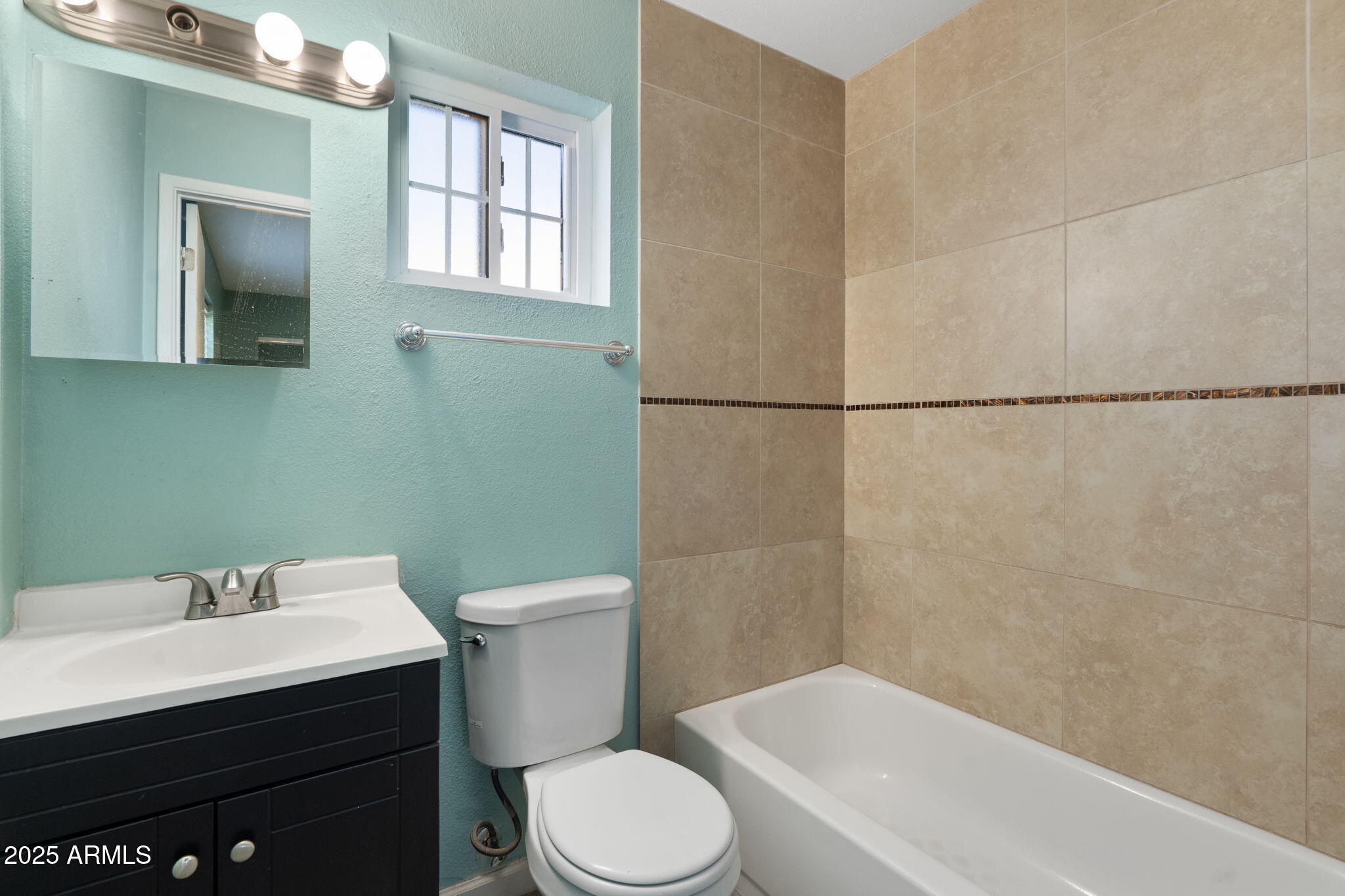 1121 West Halstead Drive Phoenix, AZ 85023 - Photo 12 of 22 a bathroom with a sink toilet and shower