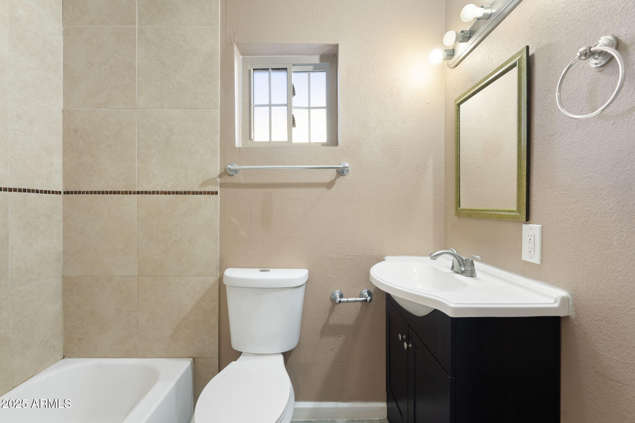 1121 West Halstead Drive Phoenix, AZ 85023 - Photo 17 of 22 a bathroom with a sink mirror vanity and toilet