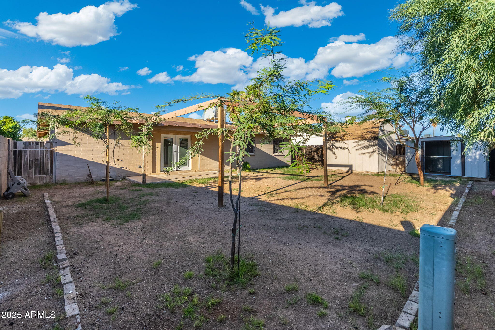 1121 West Halstead Drive Phoenix, AZ 85023 - Photo 20 of 22 a view of a house with backyard