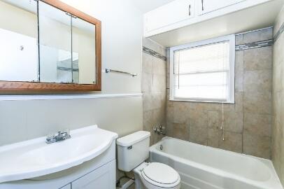 5408 31st Street Lubbock, TX 79407 - Photo 25 of 33 a bathroom with a sink toilet and shower
