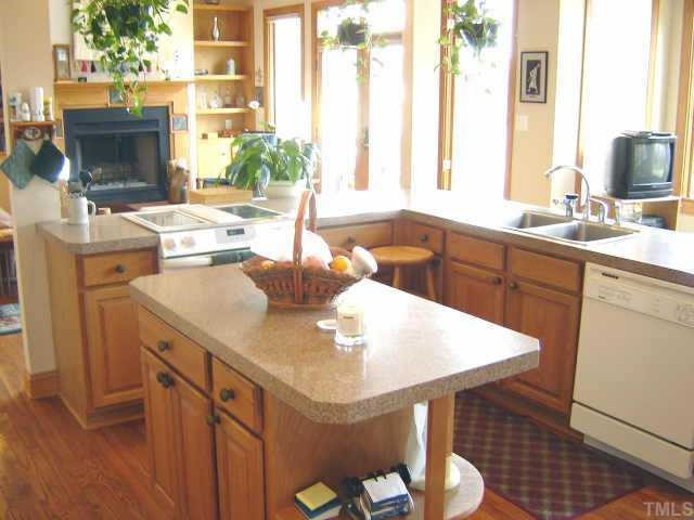 1120 Orange Factory Road Bahama, NC 27503 - Photo 3 of 10 Kitchen complete w/hardwood floors, breakfast bar, center island, granite countertops, jennaire grill & pantry Other