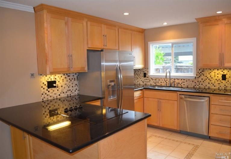 552 Racquet Club Circle Rohnert Park, CA 94928 - Photo 1 of 1 a kitchen with stainless steel appliances granite countertop a sink refrigerator and cabinets