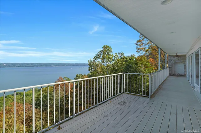 a view of a balcony with wooden floor