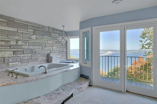 a view of a bathroom with a tub and sink