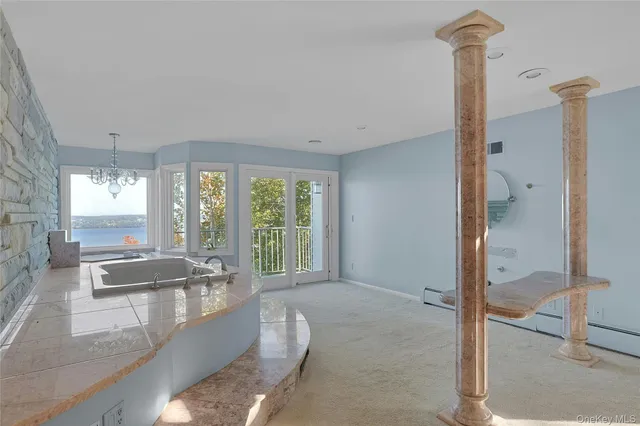 a room with kitchen island granite countertop a sink and a granite counter top