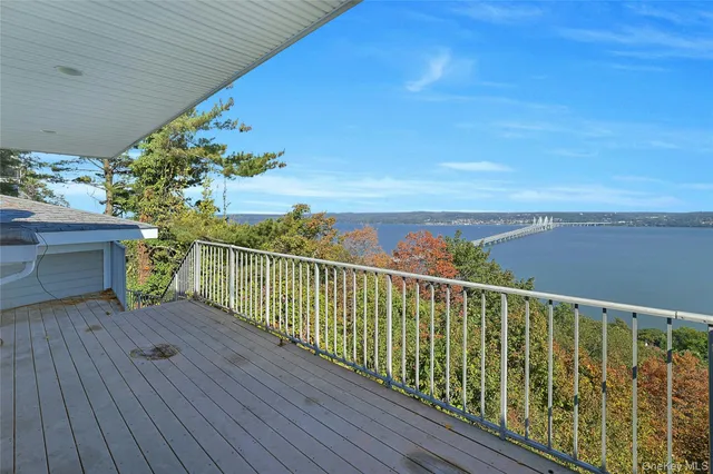 a view of balcony with wooden floor