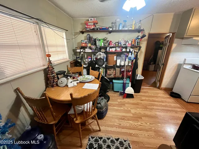 a view of a dining room with furniture and window