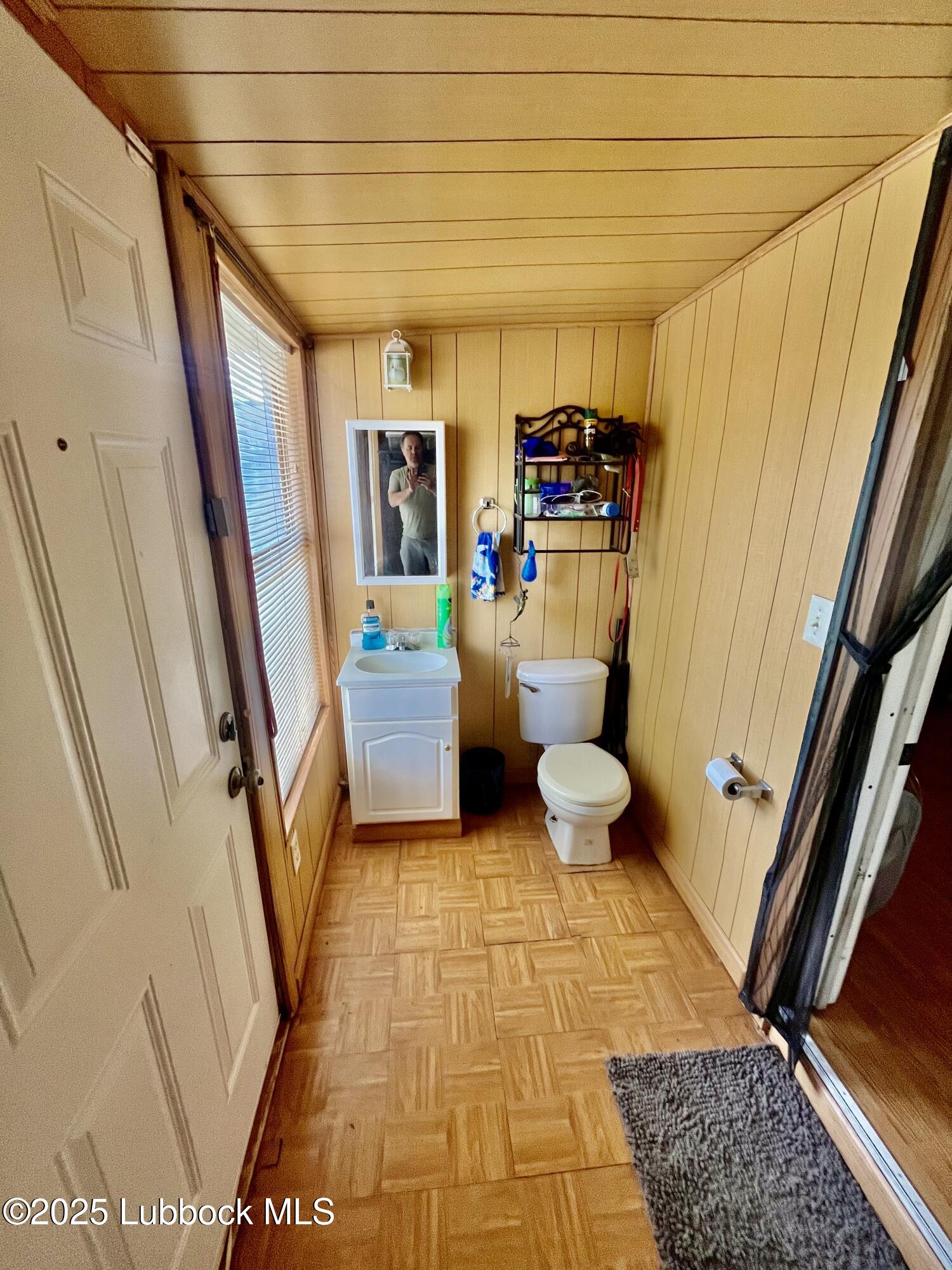 2819 35th Street Lubbock, TX 79413 - Photo 8 of 16 a bathroom with a toilet and a shower