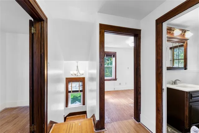a view of an entryway with wooden floor and door