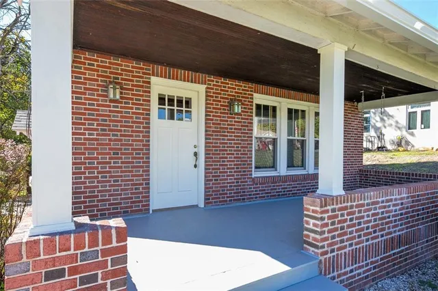 a view of front door of house with wooden floor
