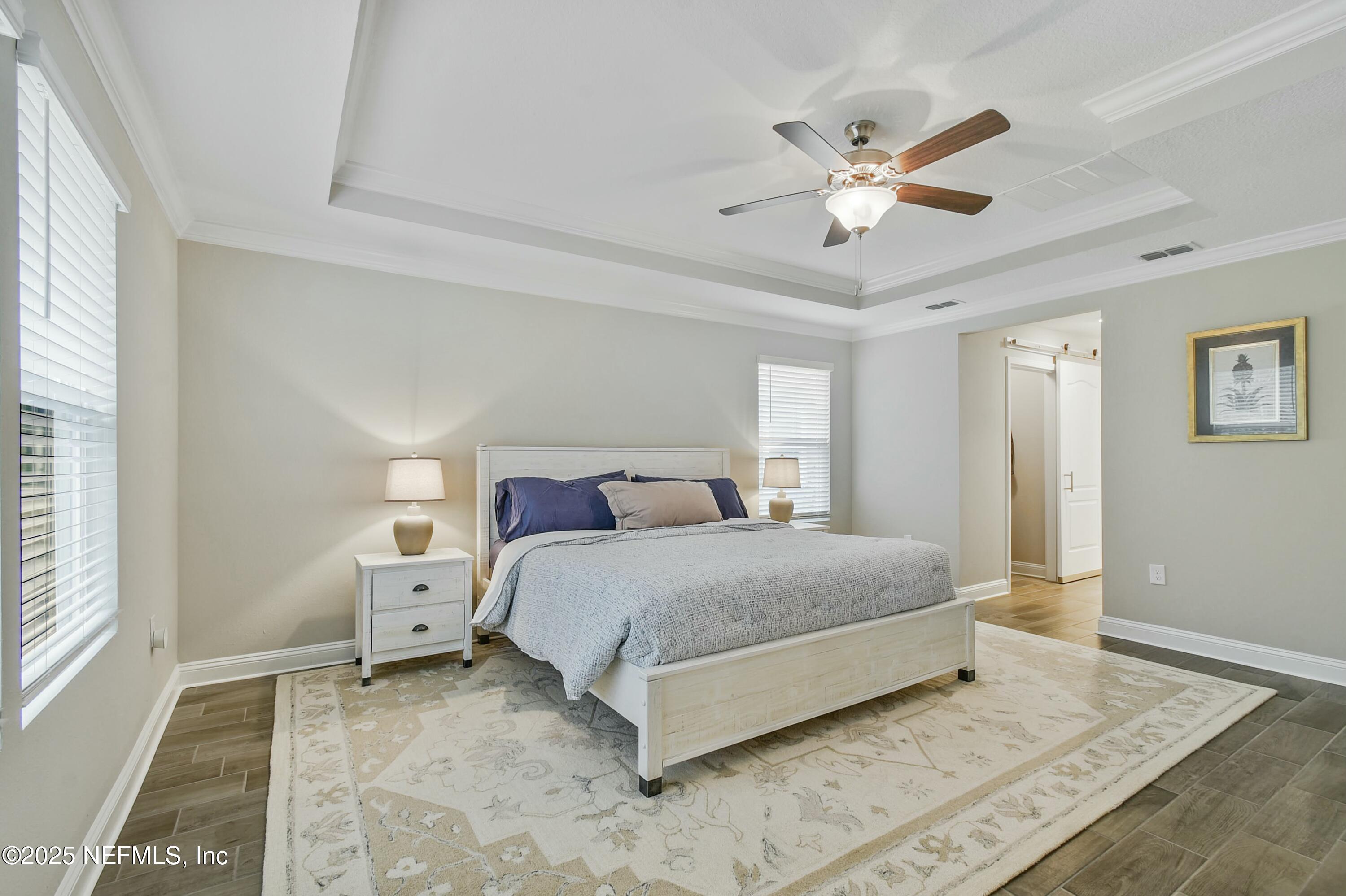 1399 Parkland Trail St. Augustine, FL 32095 - Photo 16 of 39 a spacious bedroom with a bed and window