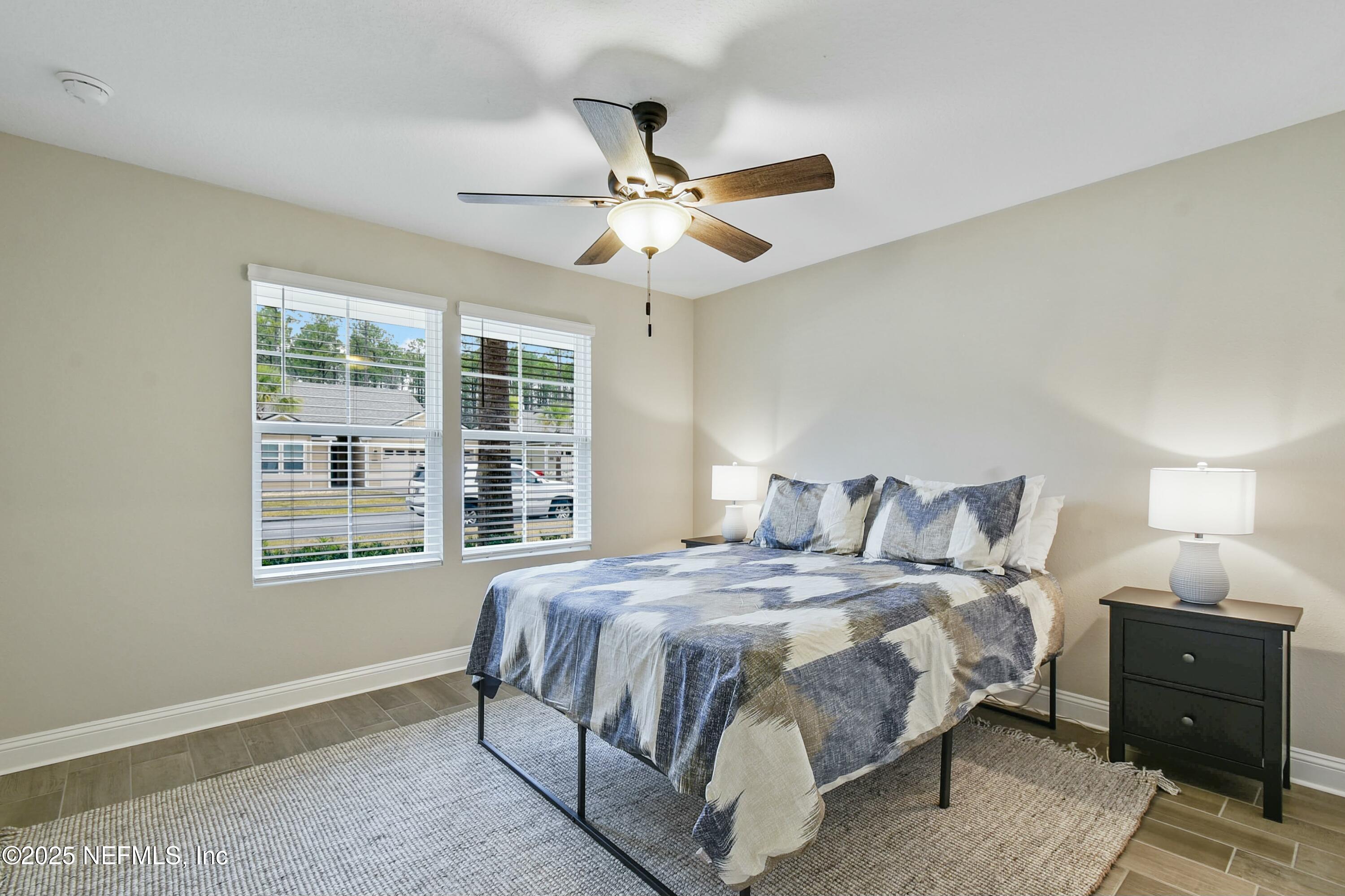 1399 Parkland Trail St. Augustine, FL 32095 - Photo 21 of 39 a bedroom with a bed and a window