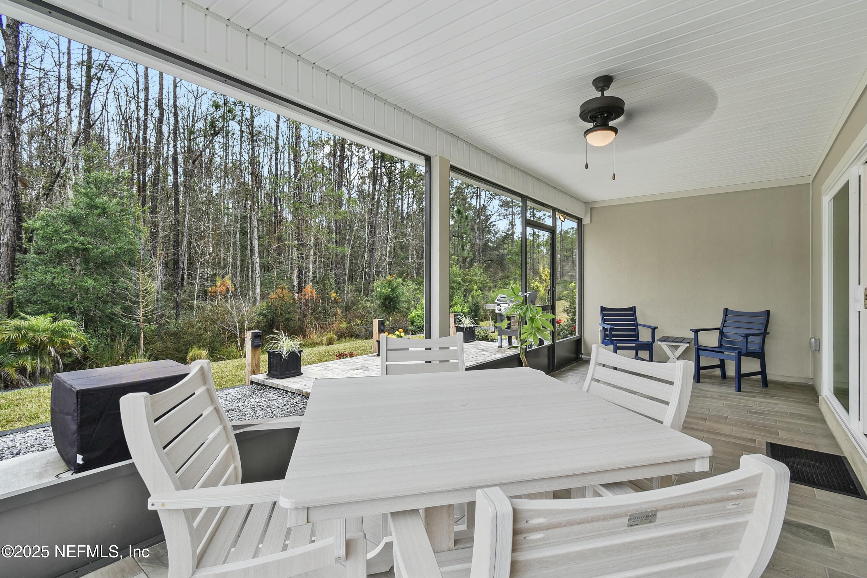 1399 Parkland Trail St. Augustine, FL 32095 - Photo 26 of 39 a living room with furniture and a large window