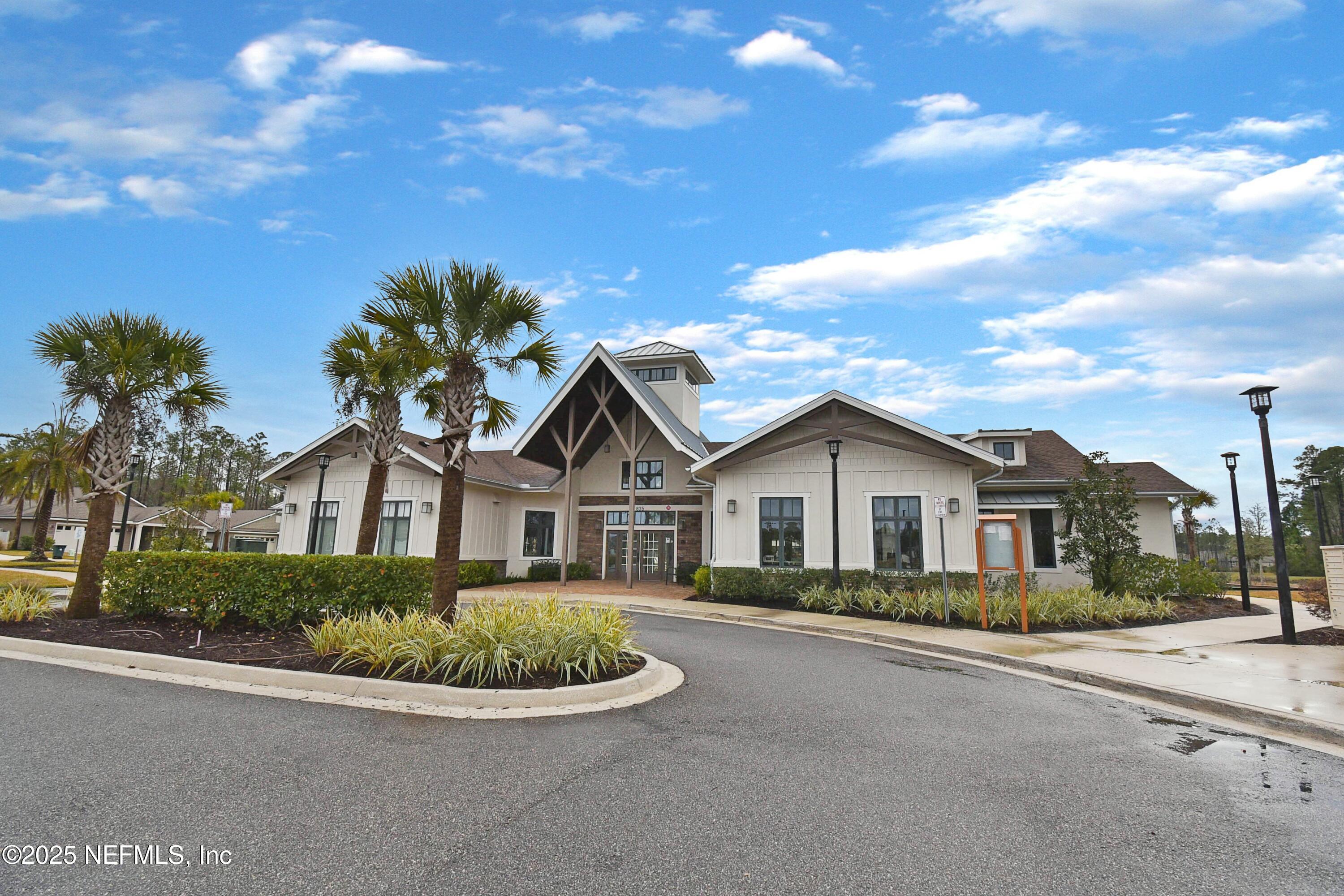 1399 Parkland Trail St. Augustine, FL 32095 - Photo 33 of 39 a front view of a house with a garden