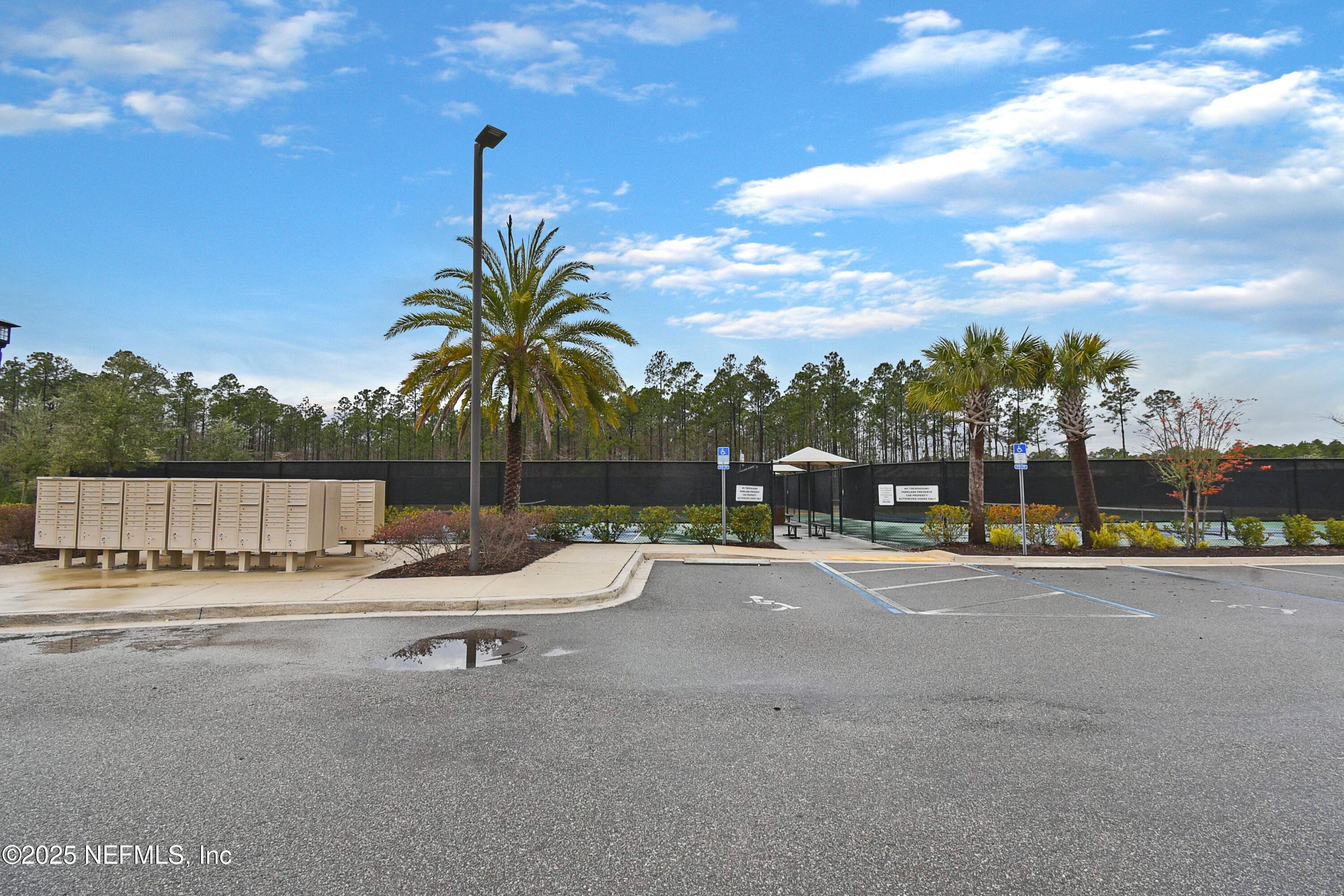 1399 Parkland Trail St. Augustine, FL 32095 - Photo 36 of 39 a backyard of a house with table and chairs