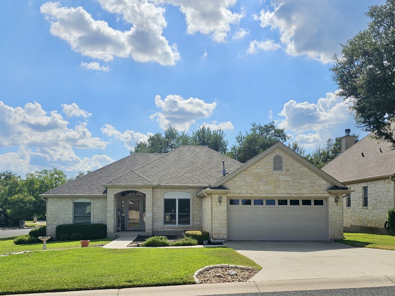 a front view of a house with garden