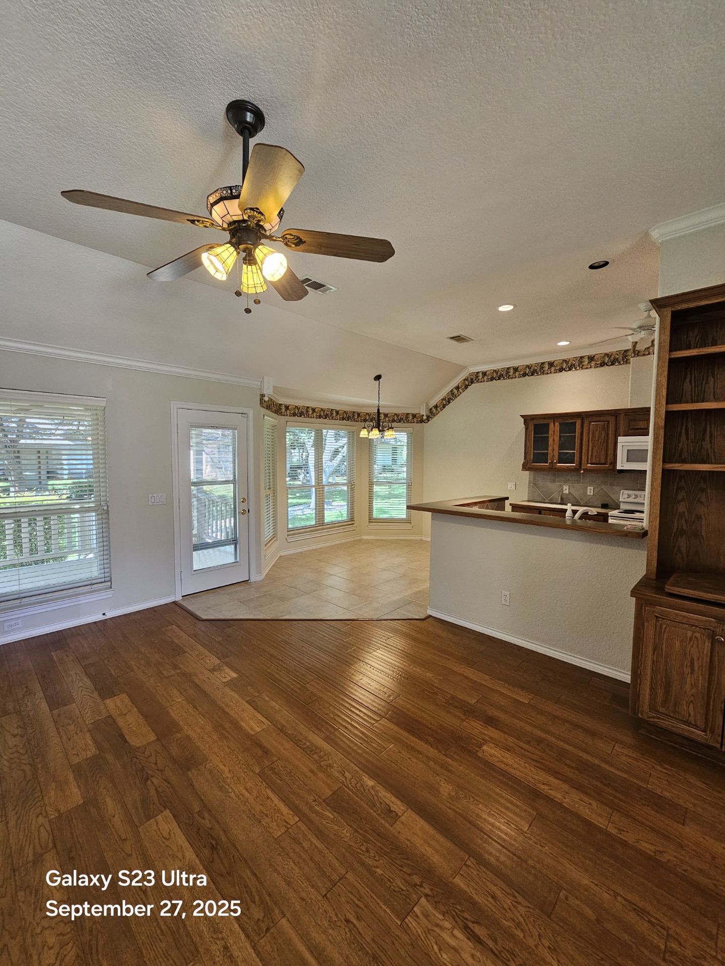 101 Texas Traditions Georgetown, TX 78628 - Photo 11 of 17 a view of an empty room with kitchen and window